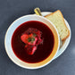 Christmas Borscht in a bowl with bread on the side